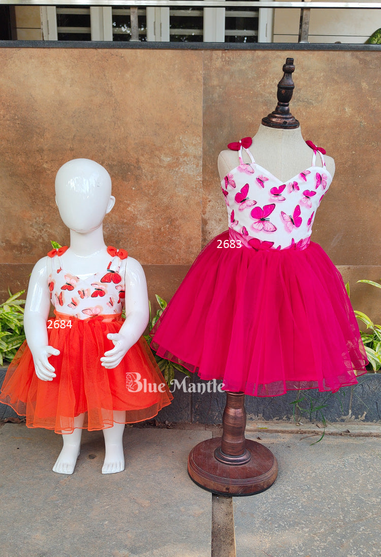 Frock compo : Orange And Pink Butterfly Printed Frocks Compo.